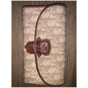 Authentic pre-owned Dior monogram wallet.